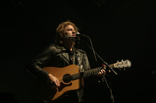 Matt Epp with his harmonica and guitar
